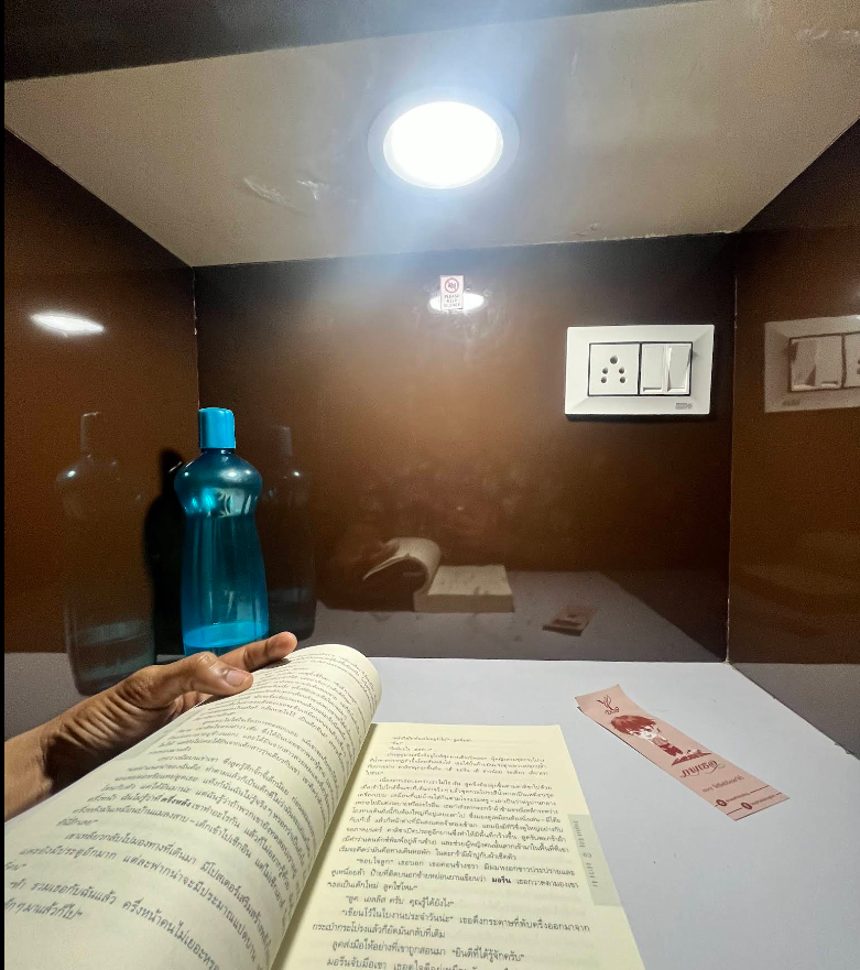 Personal study desk with light, power socket, and book